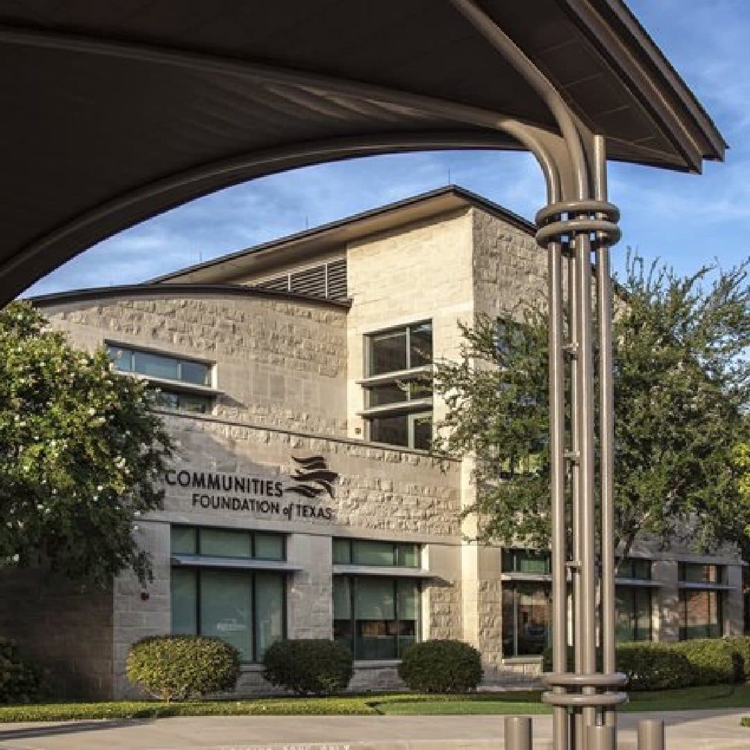 Communities Foundation of Texas building framed by a curved shade structure