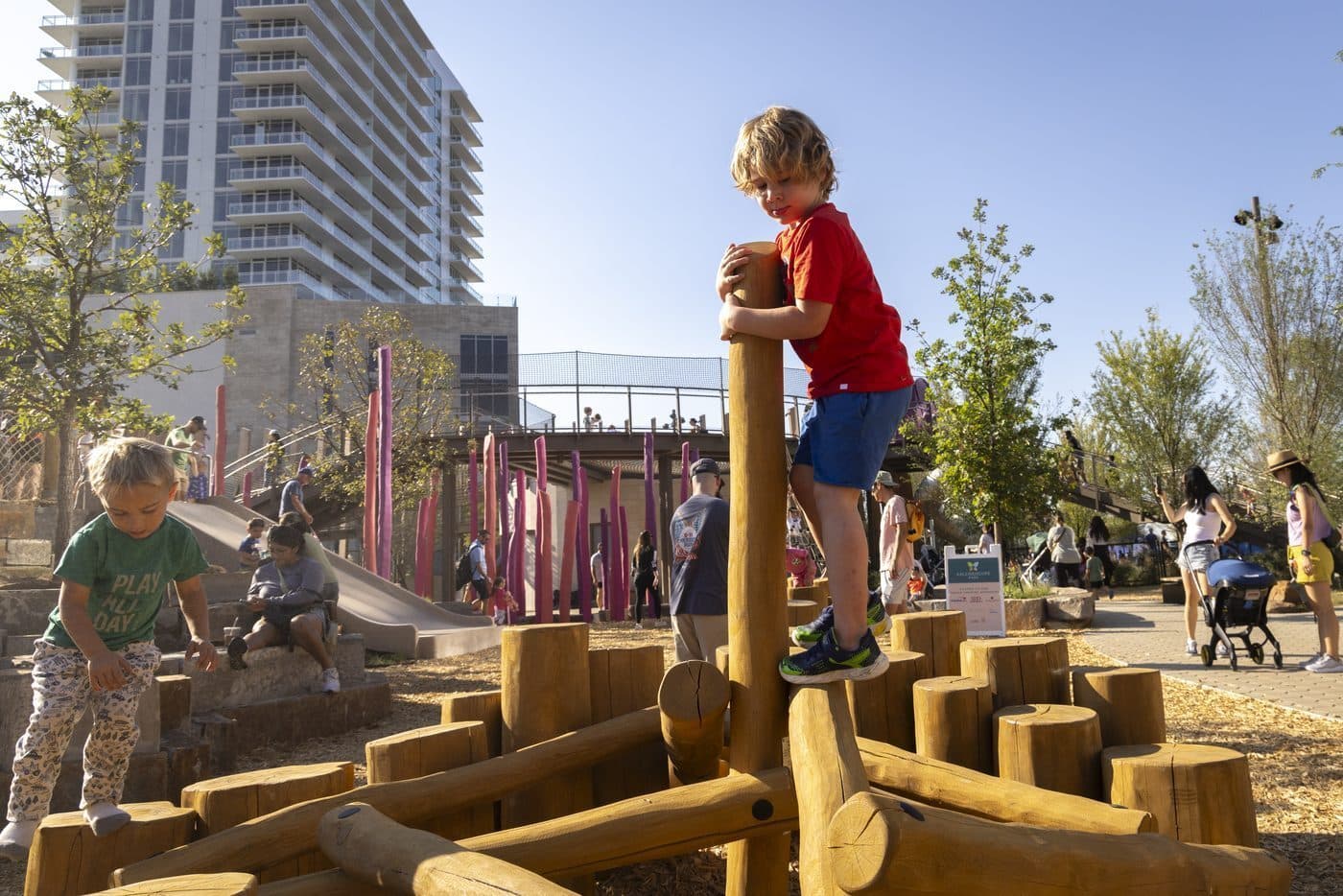 Children climbing the play structure at Kaleidoscope Park