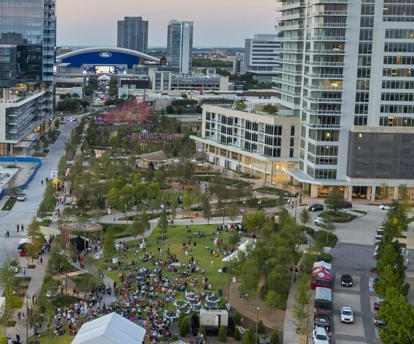 Aerial view of a large crowd at a concert on the performance lawn